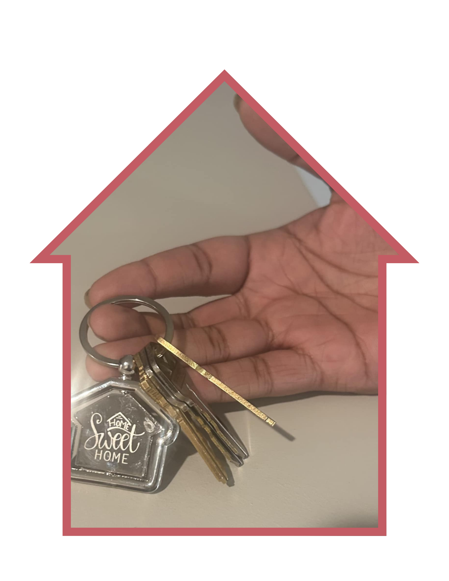A hand holding a house key.
